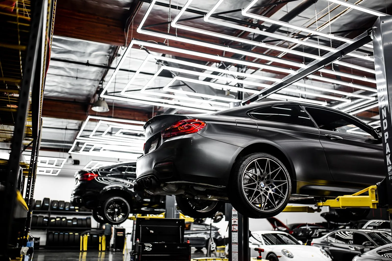 Cars in a professional workshop with vehicle lifts